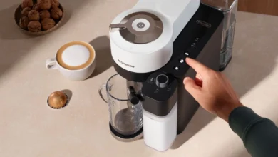 Person demonstrating how to use Nespresso machine Vertuo Lattissima.